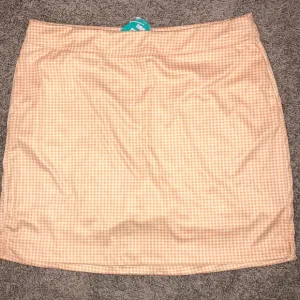 Greg Norman Play Dry Gingham Golf Skort Orange